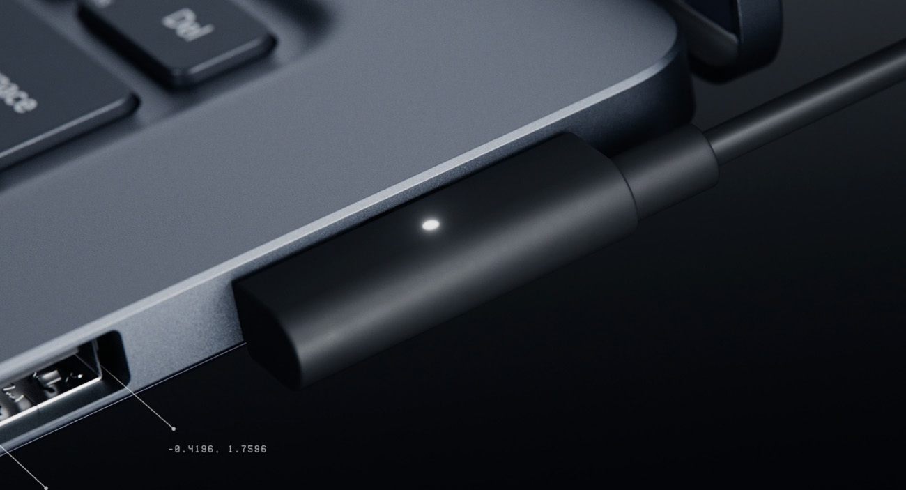 لقطة مقرّبة لكابل Magnetic Connect متصل بمنفذ الشحن في Surface Laptop Ultra.
